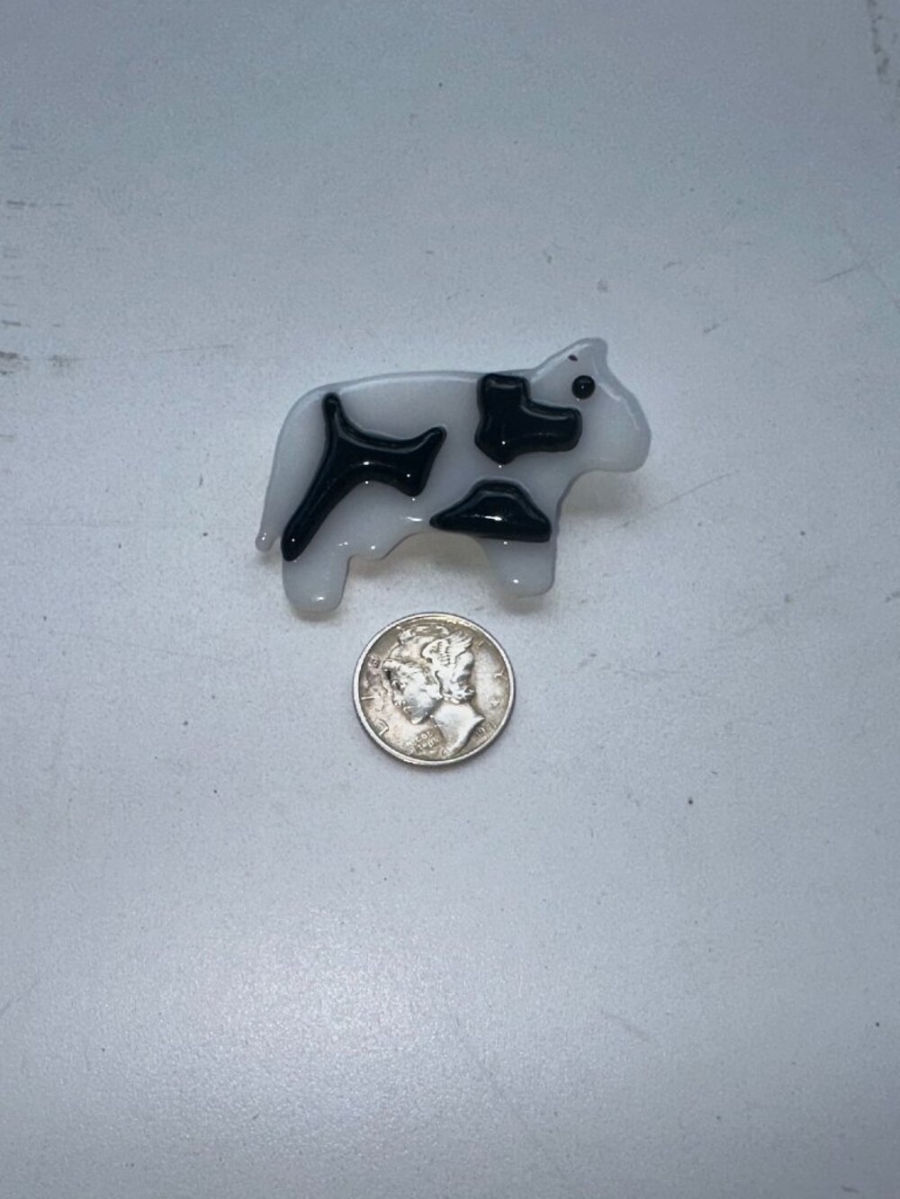 348  FUSED LAPEL/BROACH COW SMALL WHITE / BLACK SPOTS